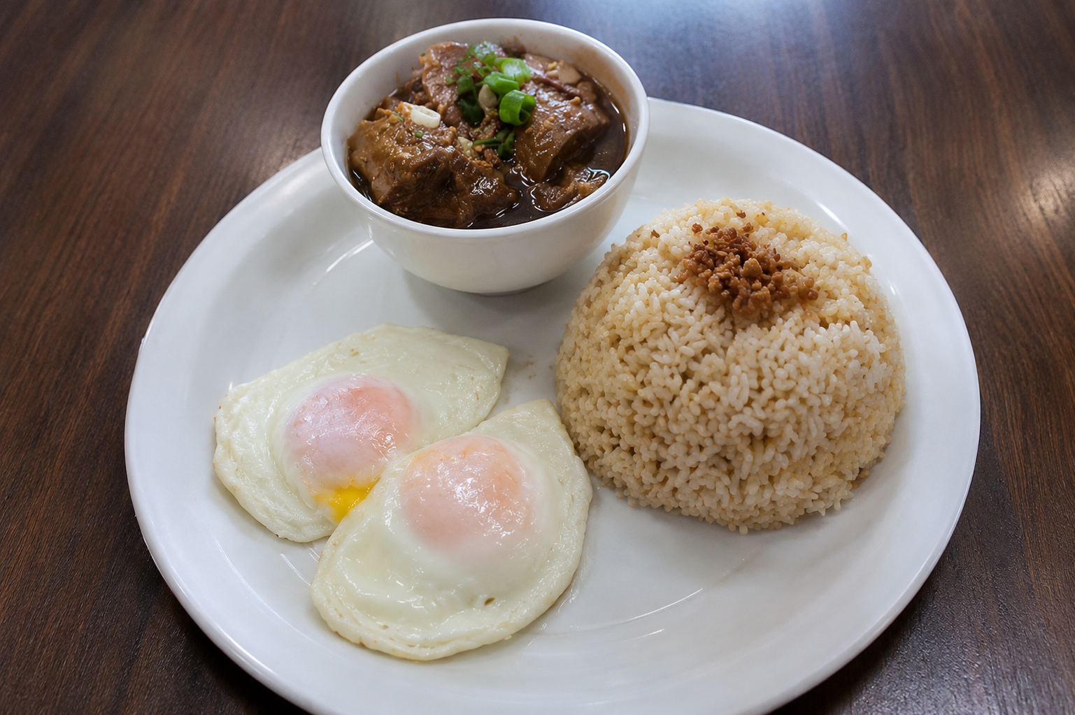 Beef Pares — star anise–braised beef with garlic fried rice and two sunny eggs